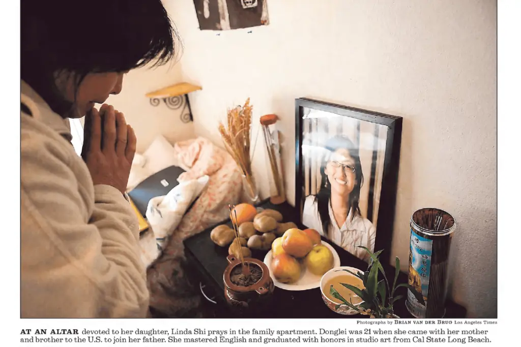 Linda Shi prays in her family's apartment.
